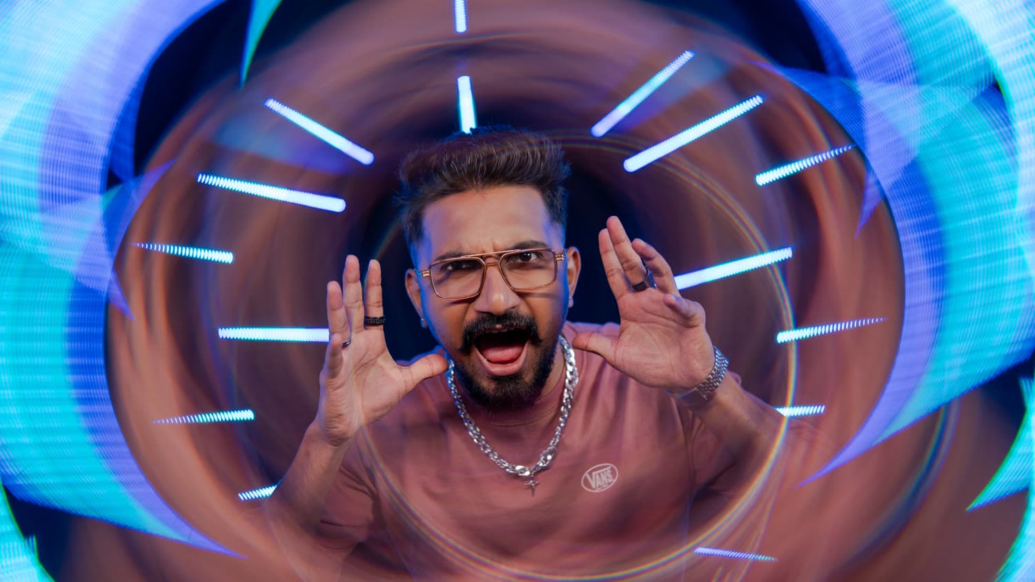Hype shot — hands framing face, mid-yell, neon backdrop