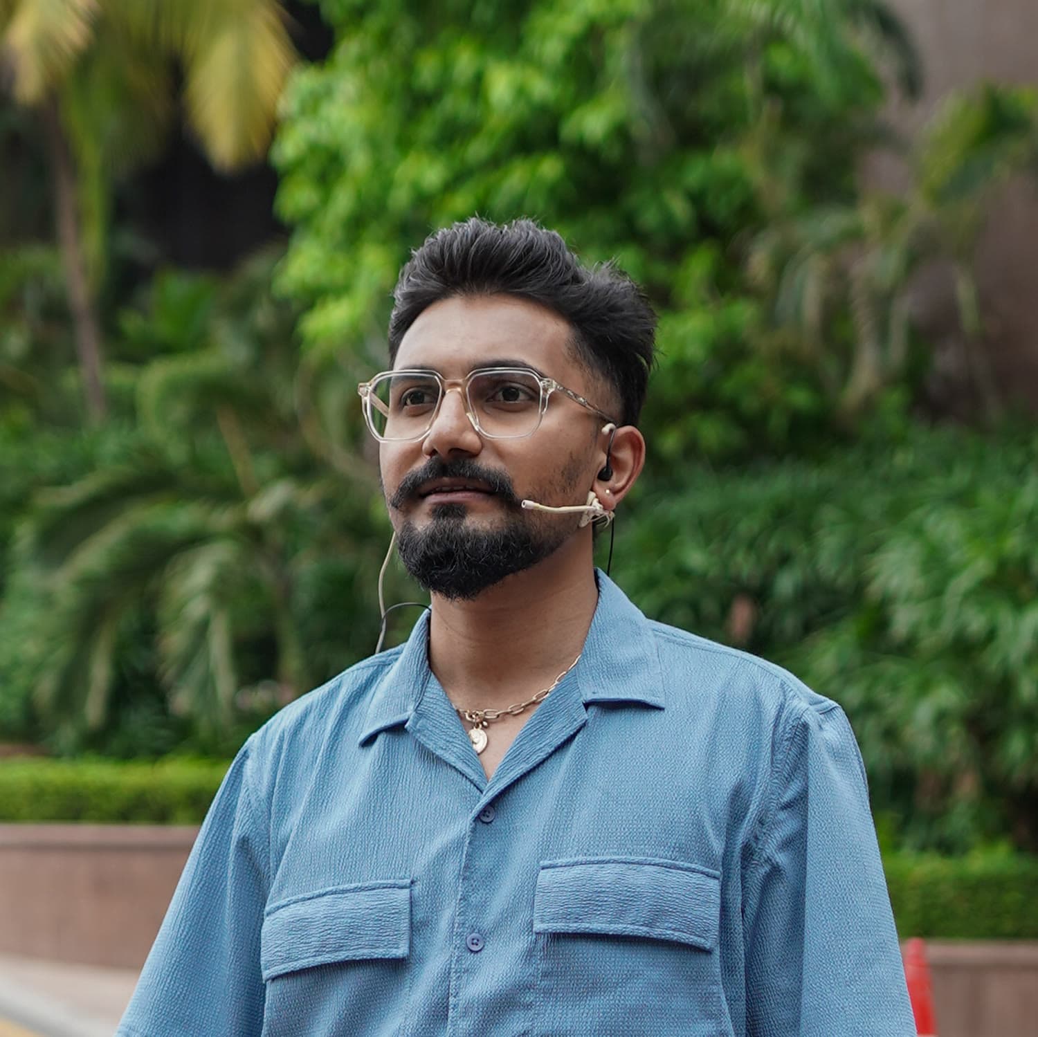Sanat Kumar R — head-and-shoulders portrait with headworn mic